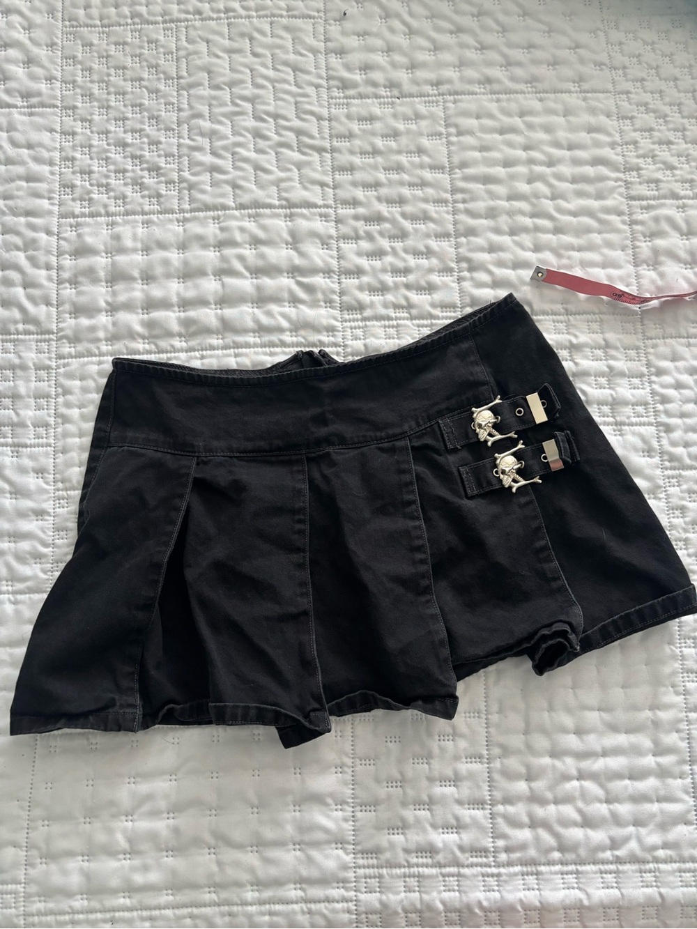 Tripp NYC Black Pleated Mini Skirt with Skull Buckle Detail
